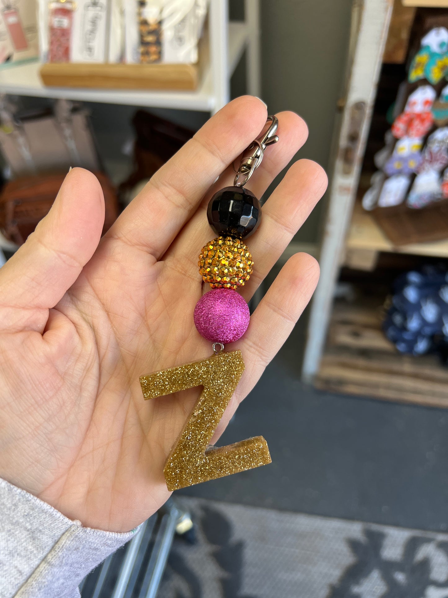 Keychain -black, gold rhinestone, textured pink beads w/ gold glitter Z