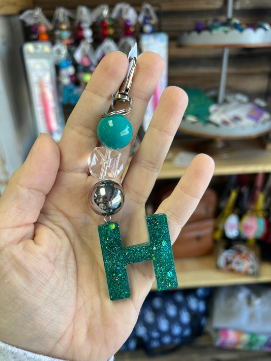 Keychain - teal solid, clear cube, black metallic beads w/ teal glitter H